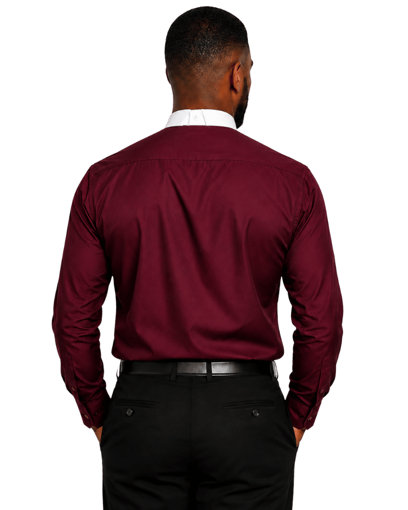 A man viewed from behind wearing a long-sleeve burgundy clerical shirt, black trousers, and a black belt against a plain white background.