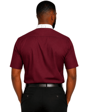 A man viewed from the back wearing a burgundy short-sleeve clerical shirt with a white collar, paired with black trousers and a black belt, against a plain white background.