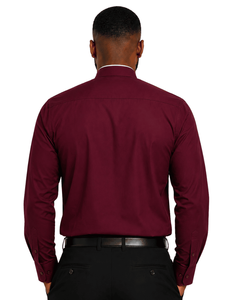 A man viewed from the back wearing a long-sleeve burgundy clerical shirt tucked into black trousers with a black belt, against a plain white background.