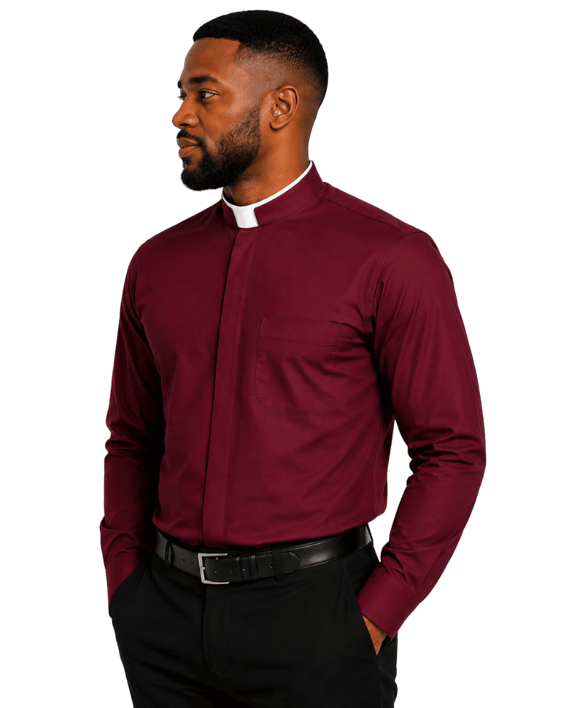 A man wearing a burgundy long-sleeve clerical shirt with a white collar, paired with black trousers and a black belt, shown against a plain white background.