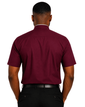 A man viewed from the back wearing a short-sleeve burgundy clerical shirt, black trousers, and a black belt against a plain white background.