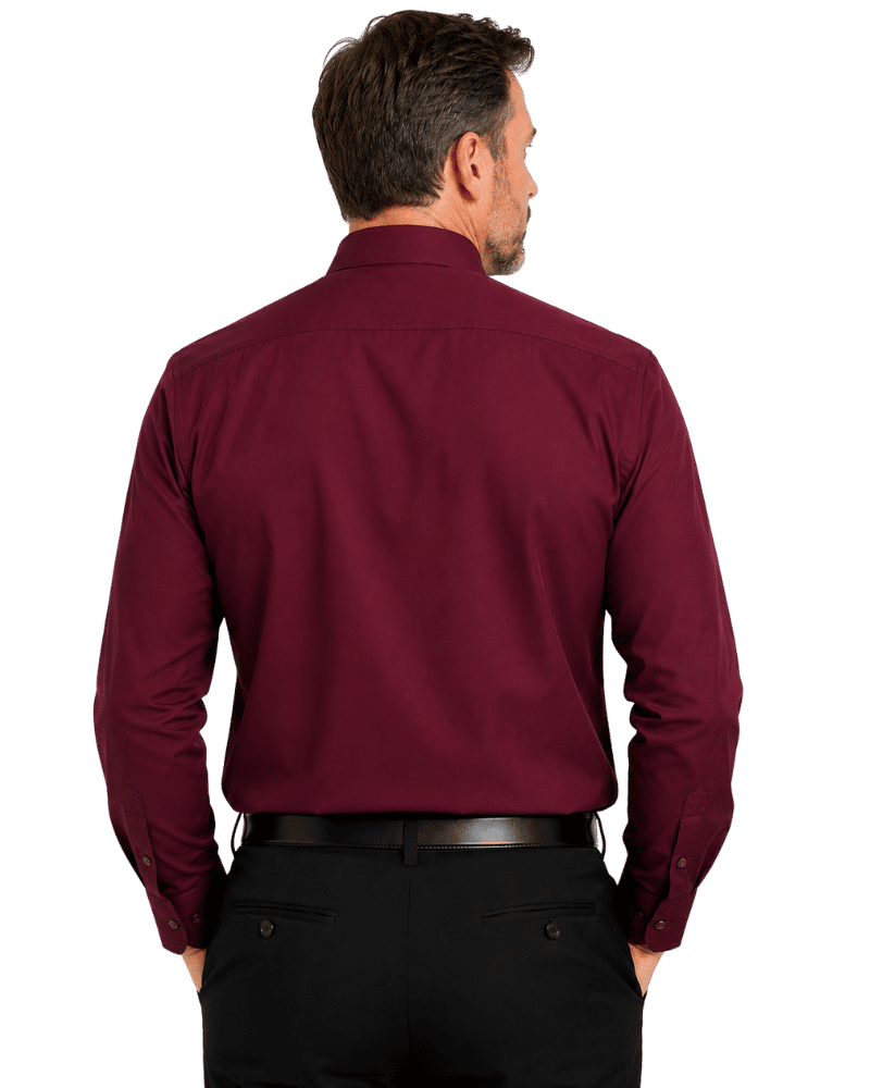 A man viewed from the back wearing a long-sleeve clerical shirt in deep burgundy and black trousers, set against a plain white background.
