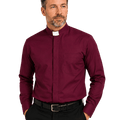 A man wearing a burgundy long-sleeve clerical shirt with a white collar tab, paired with black trousers and a black belt, photographed against a solid white background.