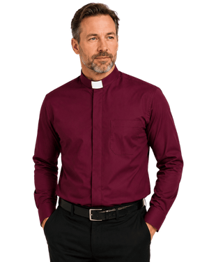 A man wearing a burgundy long-sleeve clerical shirt with a white collar tab, paired with black trousers and a black belt, photographed against a solid white background.