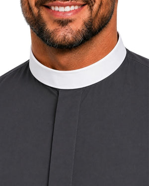 Close-up of a man wearing a dark charcoal gray clerical shirt with a contrasting white collar, cropped from the mouth down against a white background.