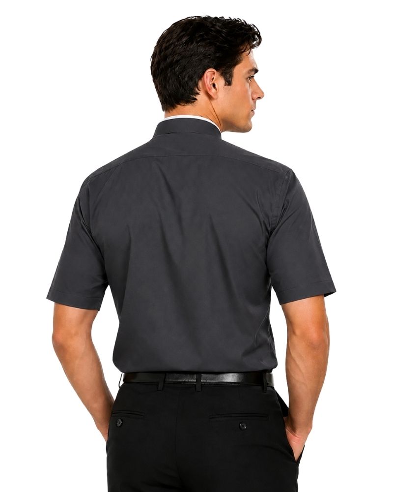 A man shown from the back wearing a dark charcoal gray short-sleeve clerical shirt tucked into black trousers, against a plain white background.