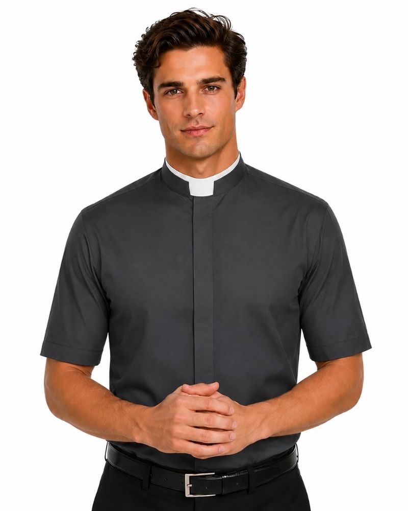 A man wearing a dark gray short-sleeve clerical shirt with a white collar, paired with a black belt and trousers, photographed against a plain white background.