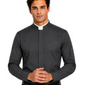 A man wearing a dark gray long-sleeve clerical shirt with a white collar, paired with black trousers and a black belt, against a plain white background.