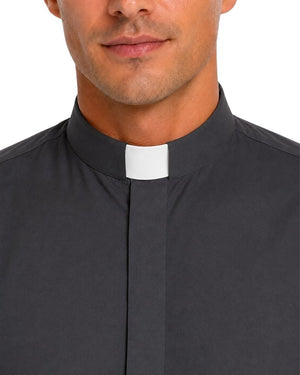 Close-up of a man wearing a dark charcoal gray clerical shirt with a white collar tab, shown against a plain white background.