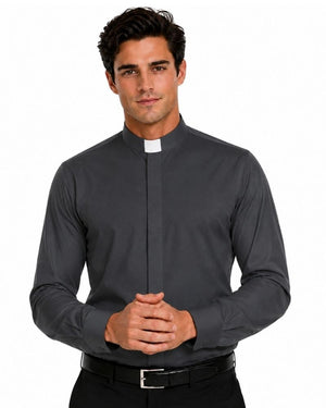 A man wearing a dark gray long-sleeve clerical shirt with a white collar tab, paired with black trousers and a black belt, against a plain white background.