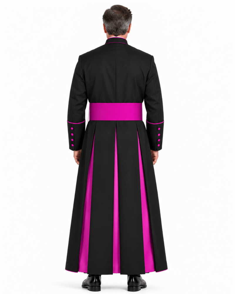 A man viewed from the back wearing a Classic Clergy Cassock With Magenta Trim at the waist and matching magenta piping details on the collar, cuffs, and sleeve buttons, against a plain white studio background.