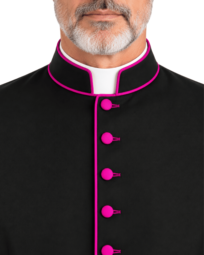 A close-up of a man wearing a Classic Clergy Cassock With Magenta Trim with bright pink piping and matching pink buttons, over a white collar, against a plain white background.