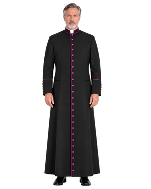 A man modeling a Classic Clergy Cassock With Magenta Trim with bright pink trim and pink buttons down the front, shown against a plain white background.