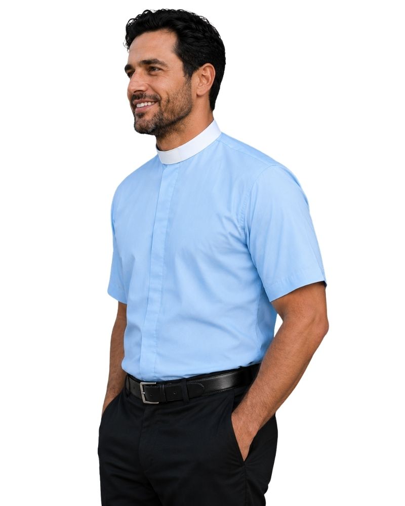 A man wearing a light blue short-sleeve clerical shirt with a white collar, paired with black trousers and a black belt, shown in profile against a plain white background.