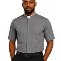A man wearing a gray short-sleeve clerical shirt with a white collar tab, black trousers, and a black belt, photographed against a plain white background.
