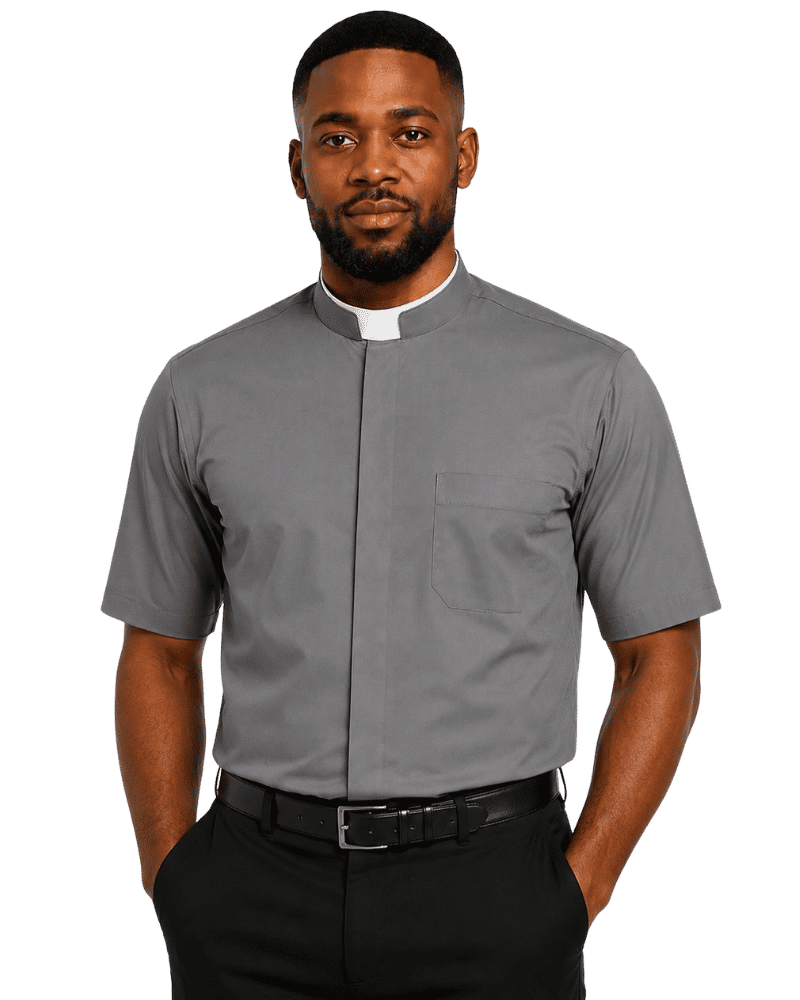 A man wearing a gray short-sleeve clerical shirt with a white collar tab, black trousers, and a black belt, photographed against a plain white background.