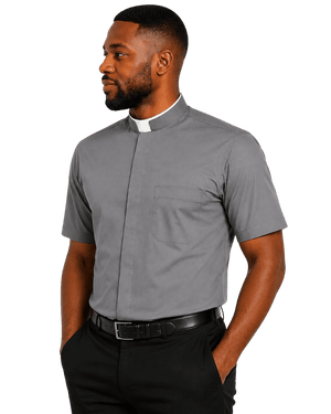 A man wearing a short-sleeve gray clerical shirt with a white collar, paired with black trousers and a black belt, shown against a plain white background.