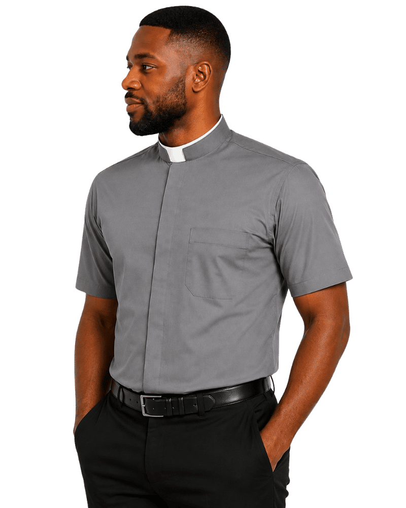 A man wearing a short-sleeve gray clerical shirt with a white collar, paired with black trousers and a black belt, shown against a plain white background.