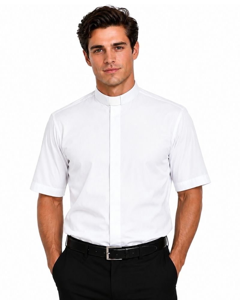 A man wearing a white short-sleeve clerical shirt with a high mock neck collar, paired with black trousers and a black belt, against a plain white background.