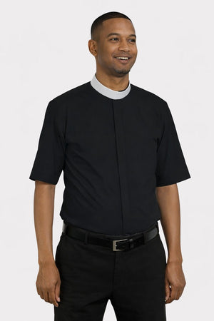 Man wearing a black shirt with a white collar on a plain background