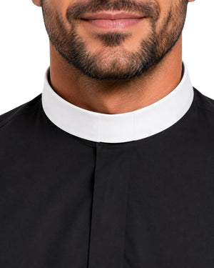 Close-up of a man wearing a black clerical shirt or tunic with a contrasting white high collar, shown against a plain white background.