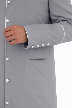 Men’s gray clergy cassock robe with white trim on a white background.
