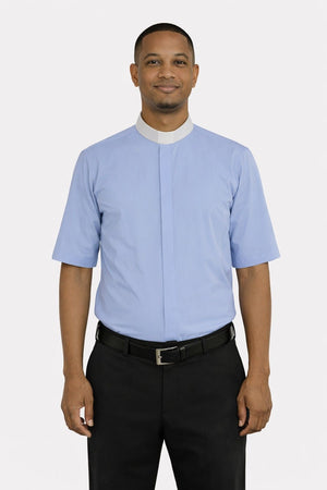 Man wearing a light blue shirt with a white collar and black pants on a white background