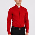 Man wearing a red shirt and black pants on a white background