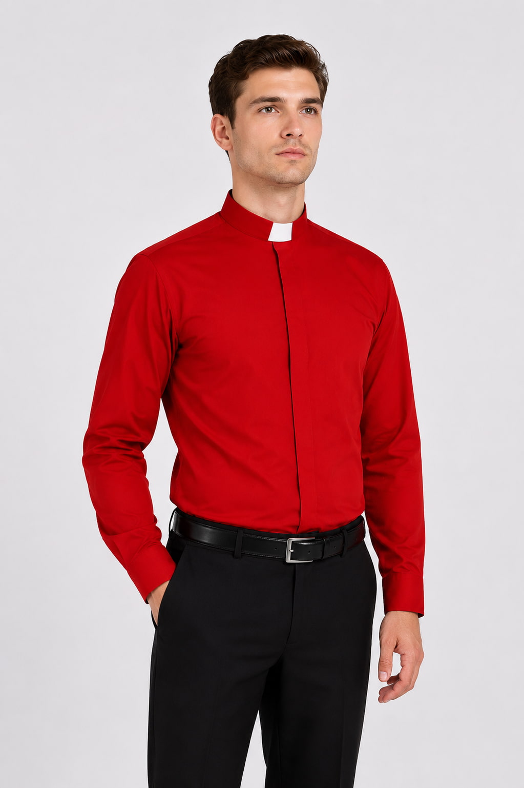 Man wearing a red shirt and black pants on a white background
