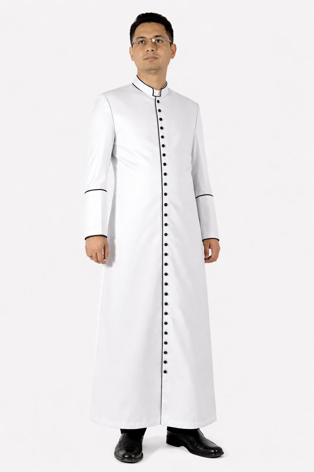 Man wearing a long white robe with black buttons on a white background