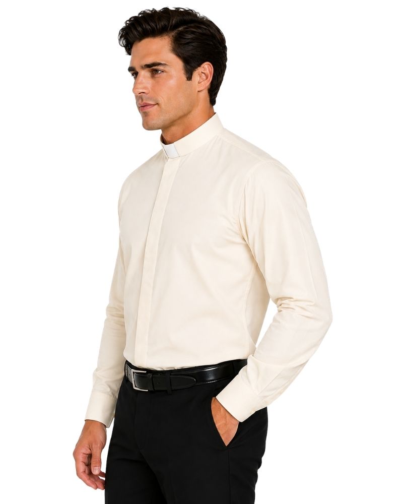 A man wearing a cream-colored long-sleeve clerical shirt with a traditional collar, paired with black trousers and a black belt, shown in profile against a white background.