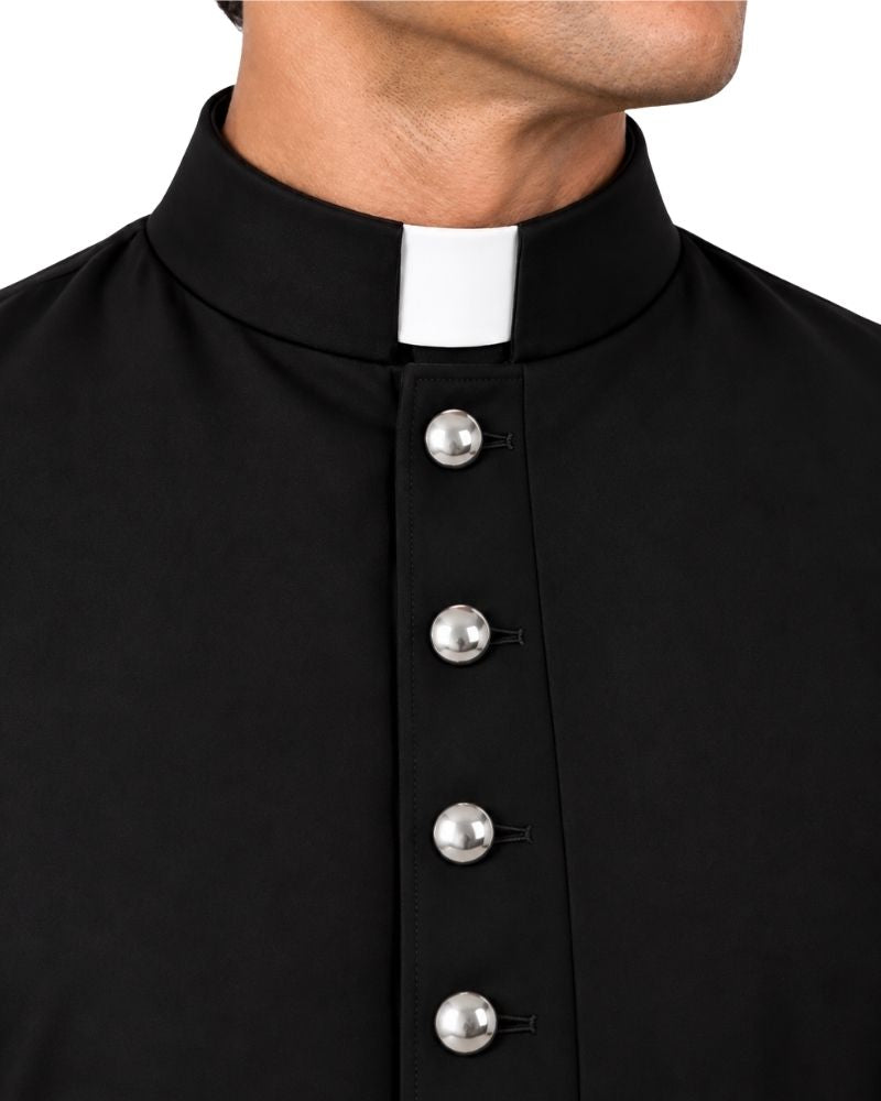 Closeup of the man wearing Dominus Steel Button Cassock against the white background.