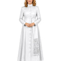 A woman modeling a long white or silver-white long robe with a high stand collar, front buttons, long sleeves, and a decorative fringed panel near the lower skirt, shown against a plain white background.