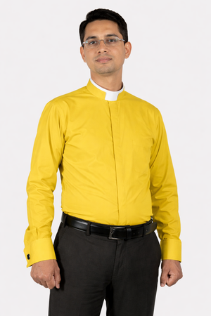 Man wearing a yellow shirt with a white collar against a white background