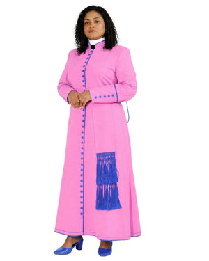 A woman modeling a long pink cassock with blue trim, blue buttons, and a blue fringe detail on the front, set against a plain white background.