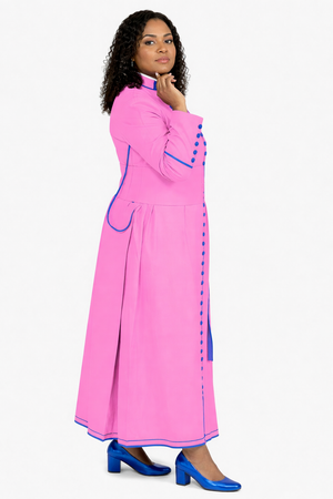 Woman wearing a long pink robe with blue accents on a white background