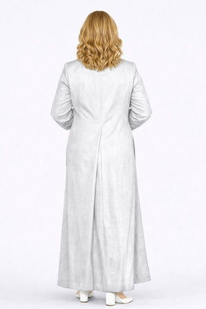 Woman wearing a long light gray robe on a white background