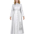 A woman modeling a long-sleeved, cassock in a light silver-gray color. The dress features a button-down front, a matching waist belt on white background.
