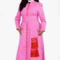 Woman wearing a pink dress with red accents on a white background