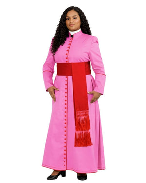 A woman modeling a pink priestly robe costume with a red waist sash and a matching red stole with fringe, set against a plain white background.