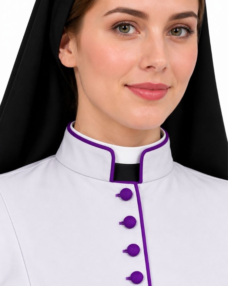 A close-up of a woman wearing a White Clergy Cassock With Purple Trim, against a plain white background.