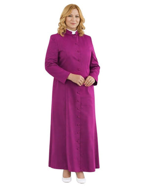 A woman modeling a long magenta-purple clerical robe with a high mock neck, front button closure, and a white collar, set against a plain white background.