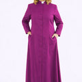 Woman wearing a long purple robe on a white background