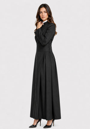 Woman wearing a black dress on a white background
