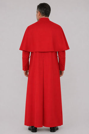 Person wearing a red robe and cape on a gray background