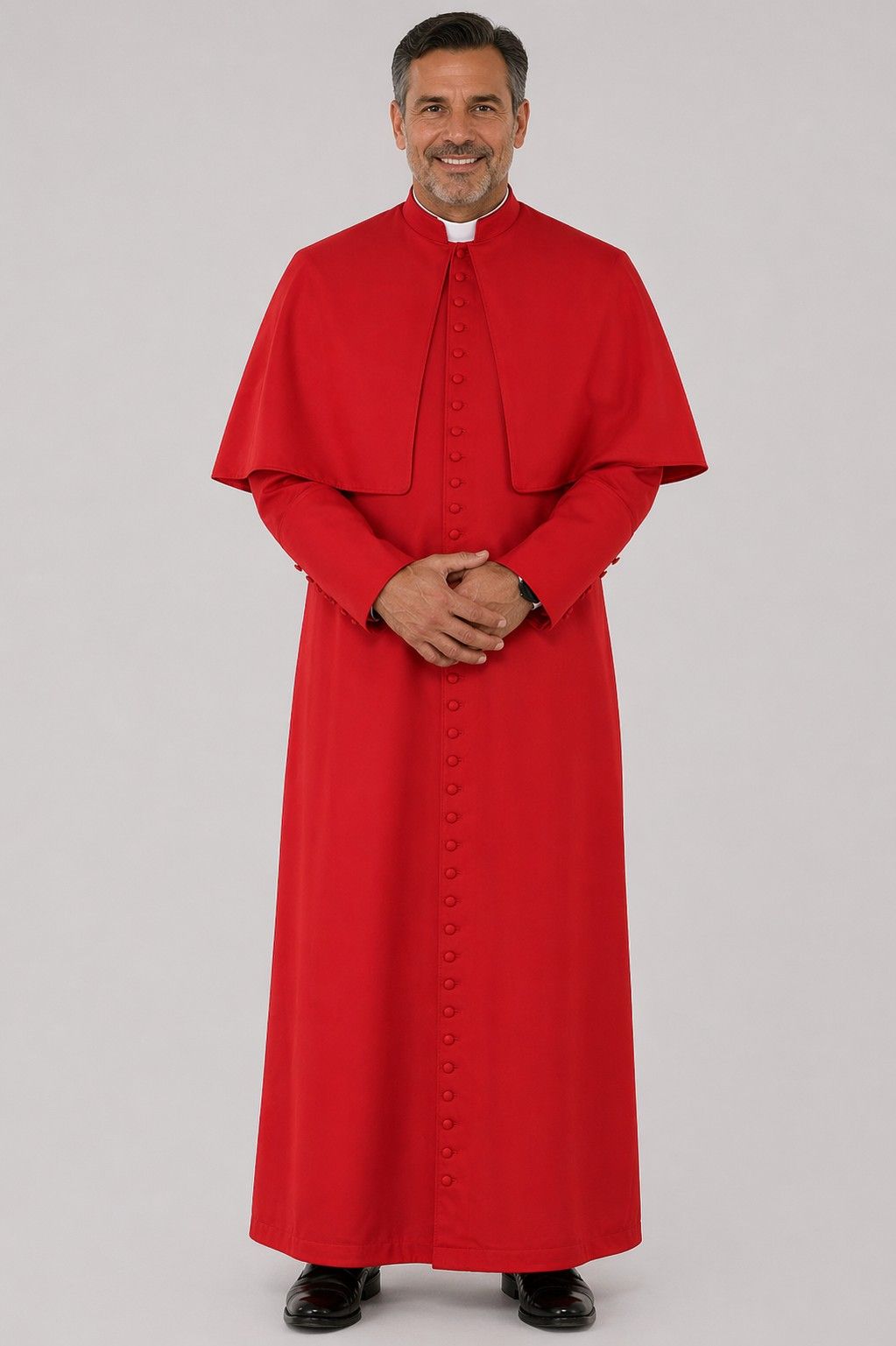 Man wearing a red religious robe on a gray background