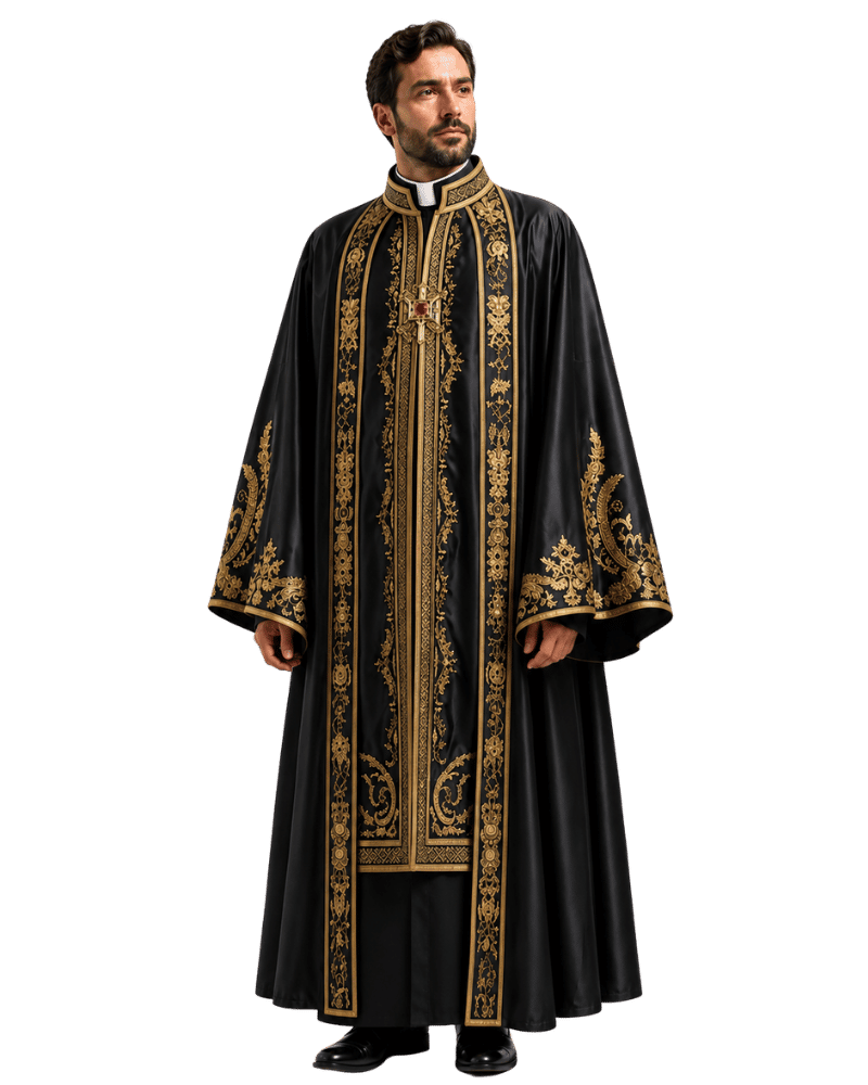 A man modeling a long black liturgical robe with ornate gold embroidery, a white collar, and a gold cross pendant, photographed against a plain white background.