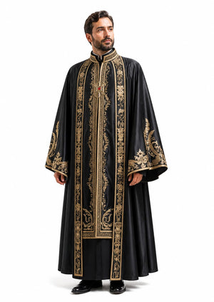 Man wearing a black robe with gold embroidery on a white background
