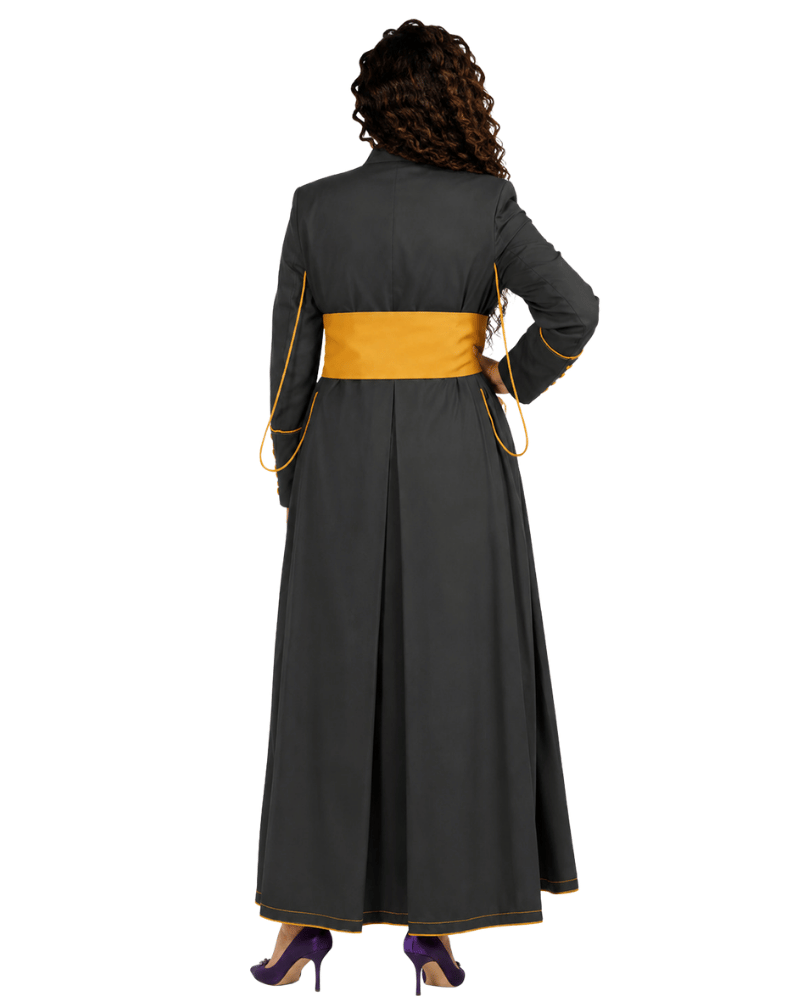 A woman shown from the back wearing a long dark gray cassock with a wide mustard yellow waist sash and thin yellow piping details, set against a plain white background.