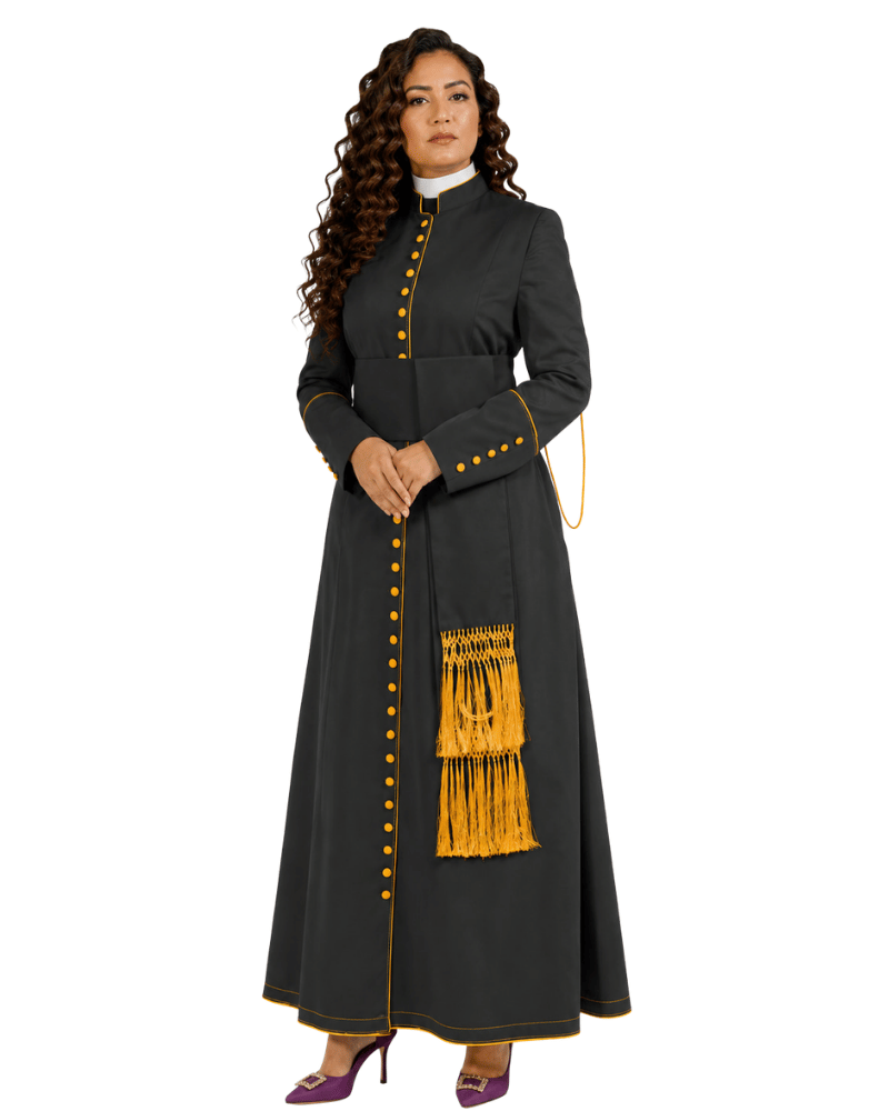 A woman modeling a long dark gray traditional cassock with gold button details, gold fringe trim, and a white collar, set against a plain white background.